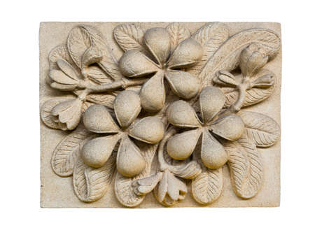 A stone inscription of a Plumeria  flower. It is anceint artの写真素材