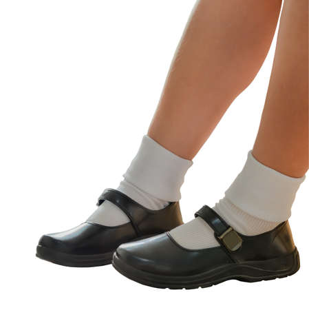 Thai girls wear a black leather shoes as a school uniform. This is an isolation of shoes and legs.の写真素材
