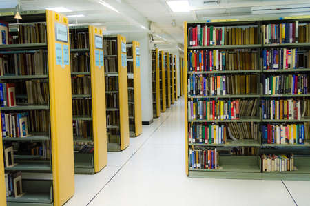 Row of bookself in a public library of Thammasat University, Thailand