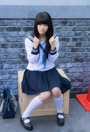 BANGKOK, THAILAND - MARCH 31: Cute Thai cosplayer dresses as Japanese schoolgirl posing for photograph in 3rd Thai-Japan anime festival on March 31, 2013.のeditorial素材