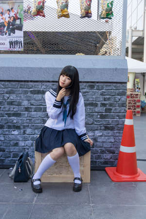 BANGKOK, THAILAND - MARCH 31: Cute Thai cosplayer dresses as Japanese schoolgirl posing for photograph in 3rd Thai-Japan anime festival on March 31, 2013.のeditorial素材