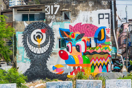 Giant graffiti on the abondon building in Thailand, shoot in public streetのeditorial素材