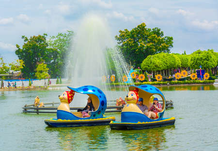 BANGKOK, THAILAND - 5 JUNE 2013: People plays animal-shape boat in the park on June 5, 2013.のeditorial素材