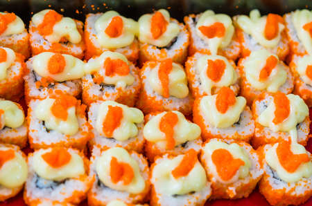Cheap Japanese maki with Ebiko  shrimp roe  and mayonnaise selling in Thai marketの写真素材