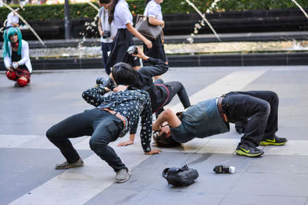 BANGKOK, THAILAND - MAY 25: Men photographers are photographing in a weird gesture in Oishi World Cosplay Fantastic 7 on May 25, 2013.のeditorial素材