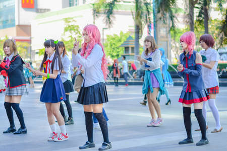 BANGKOK, THAILAND - MARCH 31: Group of Thai cosplayers dancing like cover girls for public show in the 3rd Thai-Japan anime festival on March 31, 2013.のeditorial素材