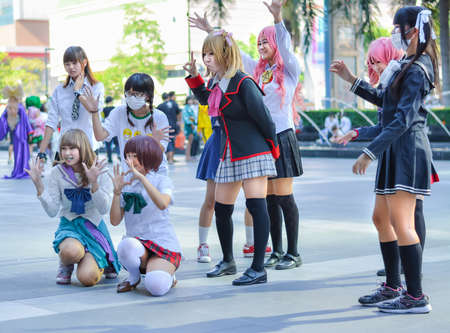 BANGKOK, THAILAND - MARCH 31: Group of Thai cosplayers dancing like cover girls for public show in the 3rd Thai-Japan anime festival on March 31, 2013.のeditorial素材
