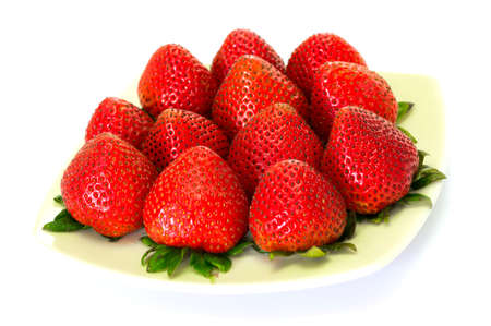 Fresh strawberry in a dish in white isolation backgroundの写真素材