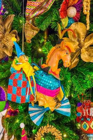 Colorful Christmas tree ornaments and decorations in night festivalの写真素材