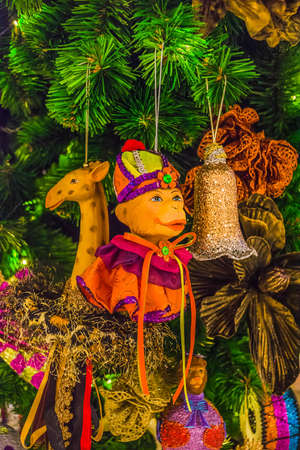 Colorful Christmas tree ornaments and decorations in night festivalの写真素材