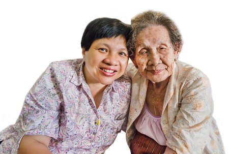 Family Portrait of an Asian elder mother and daughter hugging in isolated background