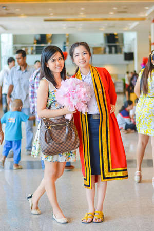 BANGKOK, THAILAND - 4 MAY 2013  Graduate Thai college student from King Mongkut s institution standing with her friend on May 4, 2014  King Mongkut s technology institution is a famous university in Thailand  のeditorial素材