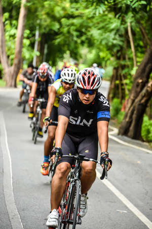 BANGKOK, THAILAND - 2 AUGUST 2014  Group of Thai mountain bikers is practicing on the rural street on August 2, 2014 のeditorial素材
