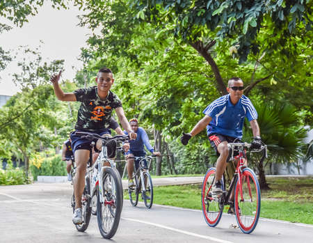 BANGKOK, THAILAND - 2 AUGUST 2014  Group of Thai military army exercise by cycling on the public street and show welcoming gesture on August 2, 2014 のeditorial素材