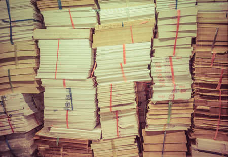 stack of old books and documents pile up together in retro colorの写真素材