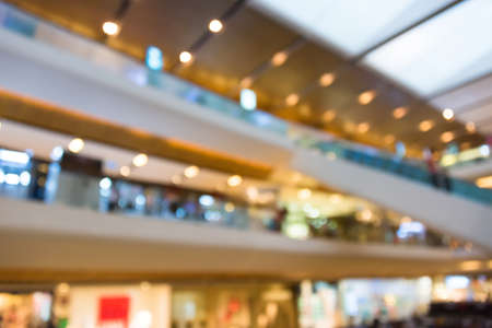 Blur photograph of an indoor building of a grand department store with escalator between floorsの写真素材