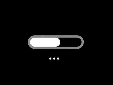 A digital animation presents a progress bar filling from left to right. The simple design uses white, gray, and black tones for the elements, creating a minimalistic composition. The loading indicator suggests a digital context. This image could be utilized for visual content related to technology, data processing, or user interface design.の素材