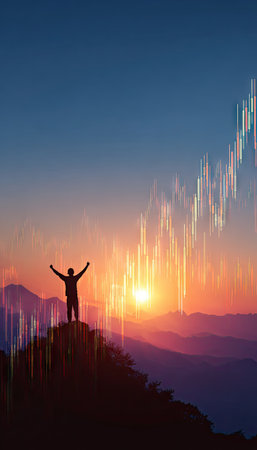 A silhouette depicts a person with arms raised, standing on a mountain peak. The scene features a gradient sky with sunset colors. A financial chart graphic overlays the scene. Suitable for use in editorial contexts concerning success, achievement or business.の素材