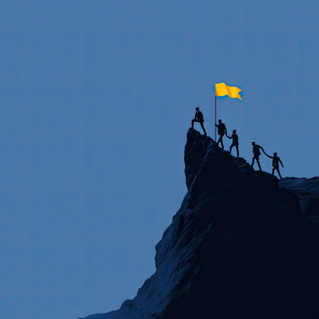 A group of silhouetted figures ascend a mountain toward a waving yellow flag. The scene features a high angle with a clear, uniform blue sky in the background, contrasting with the dark mountain. This image has commercial applications for illustrating themes like teamwork, achievement, and overcoming obstacles.の素材