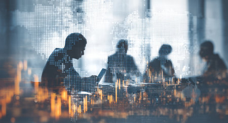 A group of professionals collaborates in an office setting. Silhouetted figures engage in discussions around a table, overlaid with a digital world map and financial data visualizations. The image uses a cool color palette with soft lighting, suggesting teamwork and the exchange of ideas. Suitable for various commercial and editorial applications.の素材