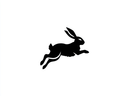 A black silhouette depicts a rabbit in mid-leap against a pristine white backdrop. The composition is simple, with the animal's form in sharp contrast. This minimalist style suggests potential use in design projects, advertisements, and other commercial contexts. The image's clean aesthetic lends itself to various visual applications.の素材