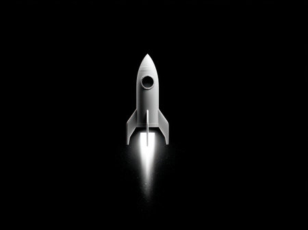 A white rocket takes off against a stark black background, leaving a trail of bright, glowing exhaust. The image presents a clean, minimalist style with strong contrast and overhead lighting. The composition suggests motion and upward trajectory, useful for illustrating concepts like technology, progress, or space exploration.の素材