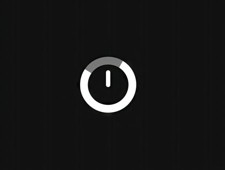 A simplified circular power button icon featuring a partial white ring and an inner symbol is presented against a stark black backdrop. The graphic utilizes contrasting light and dark tones to create emphasis. This versatile element is suitable for web design, app interfaces, and presentations, offering a clear visual cue for interaction.の素材