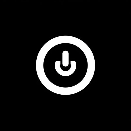 A white power button icon is centered against a stark black background, emphasizing simplicity. The design features a smooth, circular outline with the iconic power symbol contained within. The image employs bold contrasts and a minimalist style, suggesting digital technology. It could be used for various design projects or visual communication.の素材