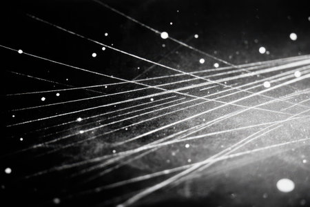 This abstract image features bright, white lines and scattered particles against a dark background. The composition uses diagonal lines to create movement and depth. The overall visual effect suggests energy and motion. Suitable for various design projects, including digital art, presentations, and website backgrounds, the image offers creative flexibility.の素材