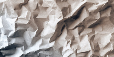 This image features a detailed close-up of textured, crumpled paper. The composition is filled with deep folds, sharp shadows, and various shades of white and gray, creating a dynamic visual effect. Suitable for use in design projects, it offers a versatile background for various commercial and creative applications.の素材