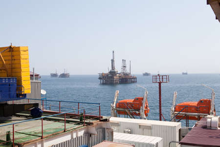 Rescue boat at oil and gas platform