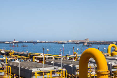 Mixed yellow pipes and connections at sea