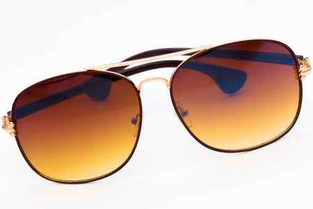 Brown sunglasses isolated on the white backgroundの写真素材