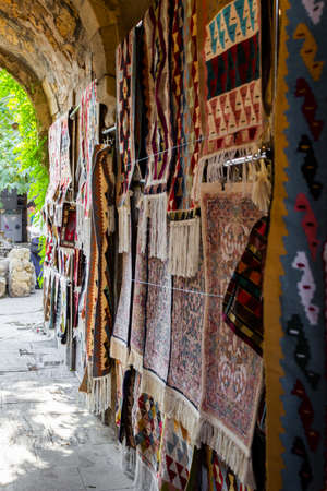 Ancient oriental handmade carpets at Old Town Baku streets. Baku Azerbaijan.の写真素材