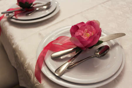 Gorgeous wedding chair and table setting for fine dining in rose and purple.の写真素材