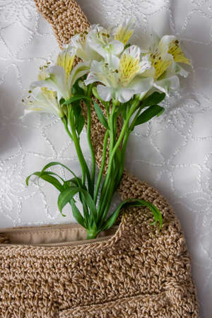 Flat lay flowers and woman bagの写真素材