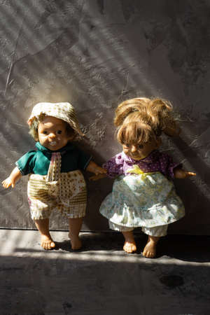 Ugly and scary dolls isolated in front of gray background.の写真素材