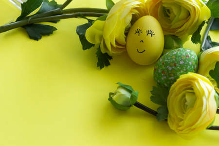 Happy Easter Day Around Yellow Flowers With Yellow Smiling Egg On a Yellow Background