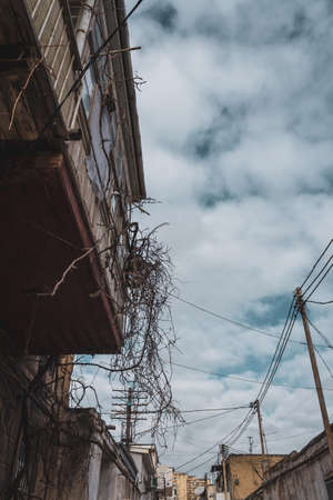 Old city with soviet streets and old houses and windows in the courtyardsの写真素材