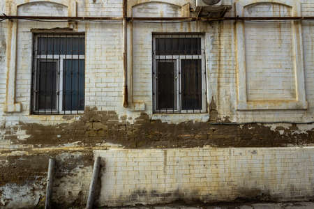 Old city with soviet streets and old houses and windows in the courtyards