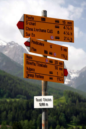 Destination board at the railroad station of Scuol in Switzerland, written in Rhaeto-Romanic languageの写真素材