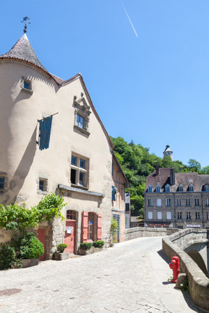 Aubusson, Creuse, France, June 2015, Medieval Pont de Terrade and the Clock Tower,  crossing the River Creuse leading to the weavers quarters for the  500 year old  French tapestry industryのeditorial素材