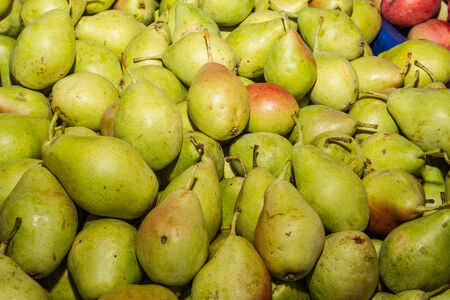 Delicious ripe fresh juicy pears at local marketの写真素材