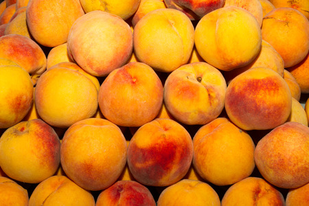 Delicious fresh juicy peaches  in local fruit market