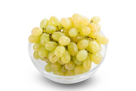Ripe fresh white grapes in glass bowl  isolated on whiteの写真素材