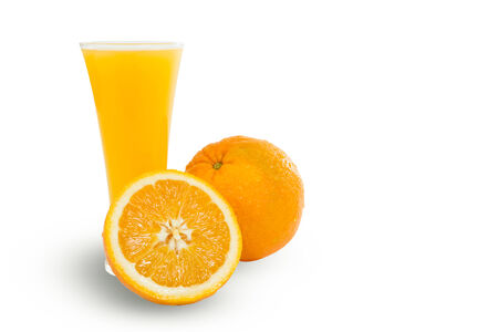Glass of delicious fresh orange juice and sliced oranges, isolated on white の写真素材