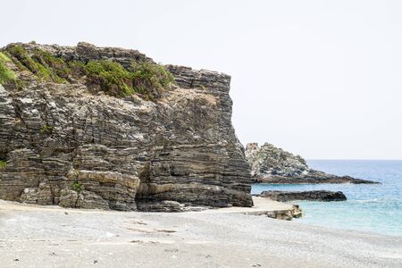 Layered folded rocks formation on southern Crete coast, Greeceの写真素材