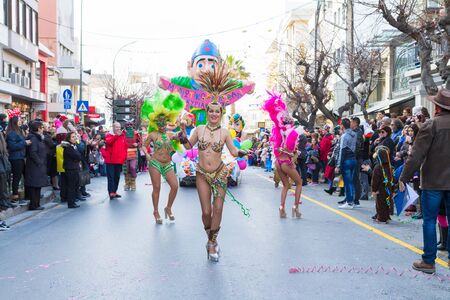 Heraklion, Crete, Greece - February 18, 2017: Mardi Gras parade in Heraklion Crete. Masqueraded carnival participants with colorful costumes, parading along the crowded main street of Heraklion.のeditorial素材
