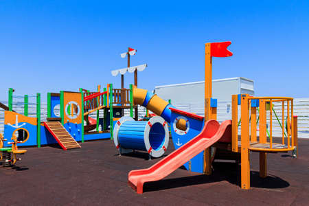 Childrens wooden playground recreation area at public parkの写真素材