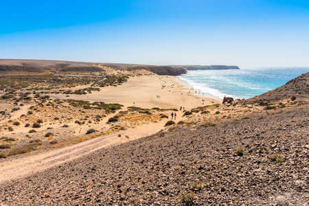 Unique panoramic view of famous Playa Blanca Papagayo beach jagged volcanic lava rock Atlantic ocean shoreline of Lanzarote, Canary Islands, Spain. Travel vacation concept.の写真素材